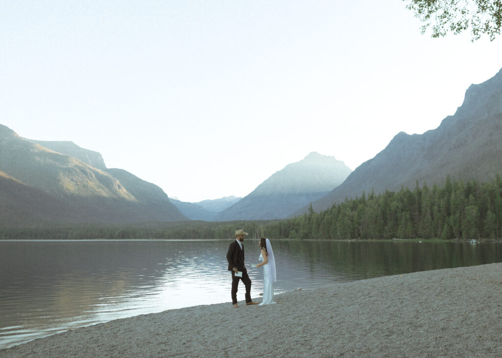bride and groom reading their vows for their Lake McDonald Elopement