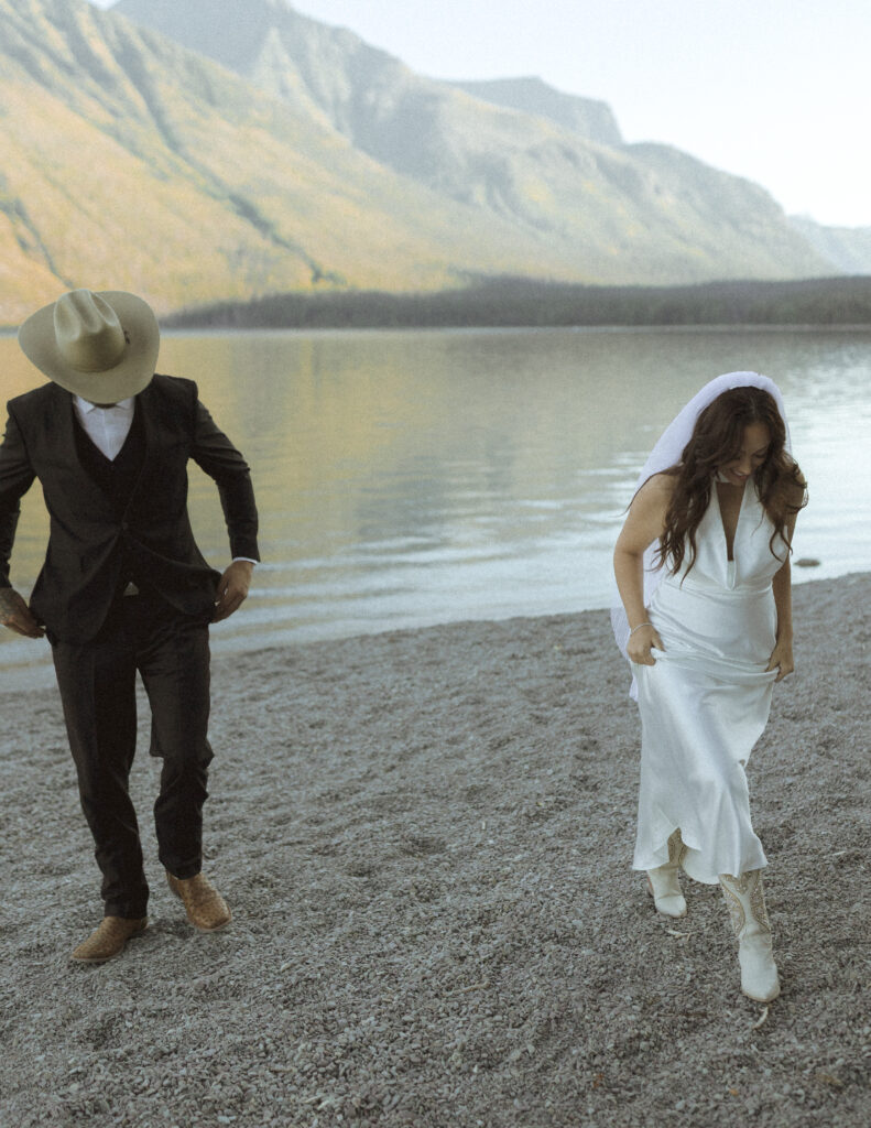 couple taking photos for their lake McDonald elopement