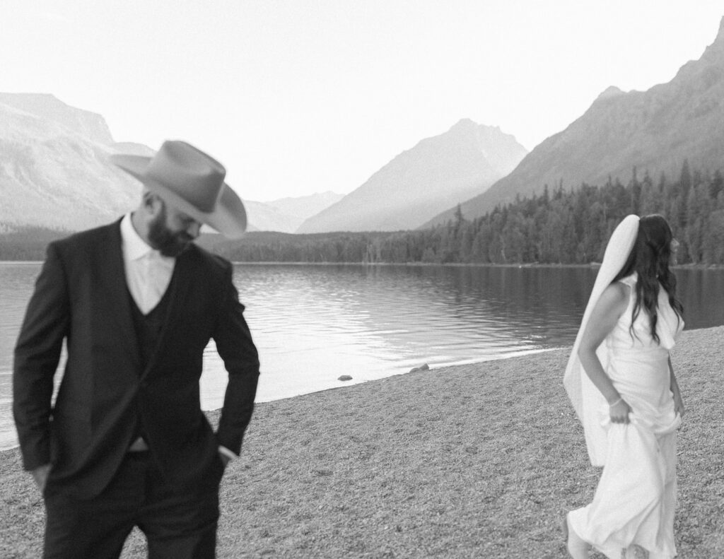 couple taking photos for their lake McDonald elopement