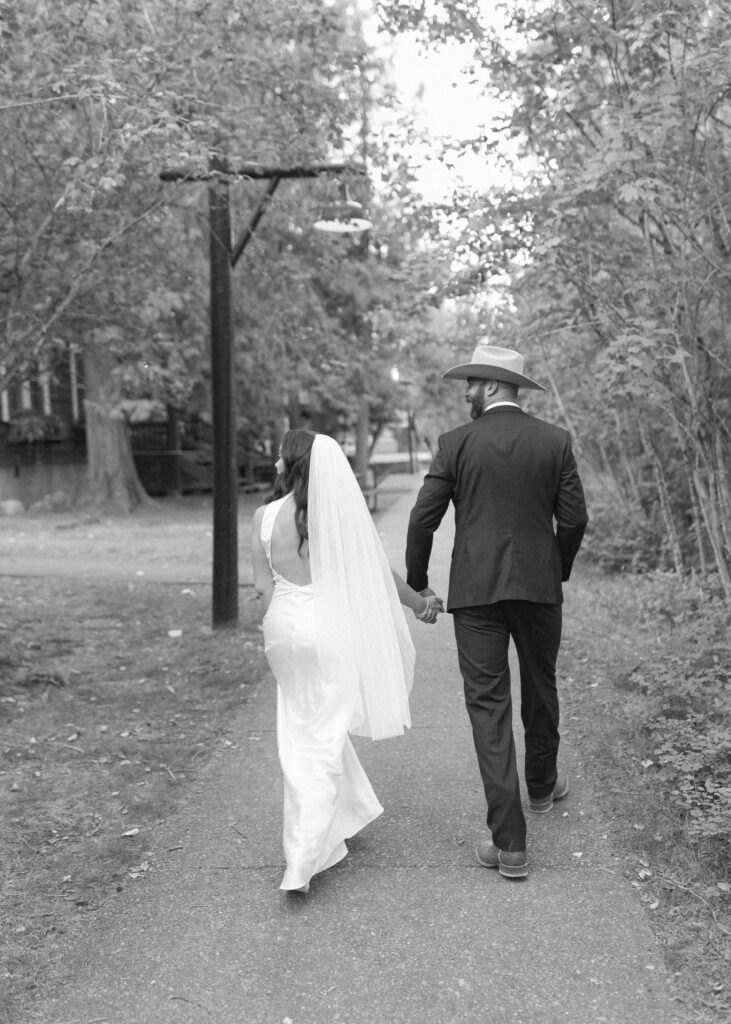 couple taking photos for their lake McDonald elopement