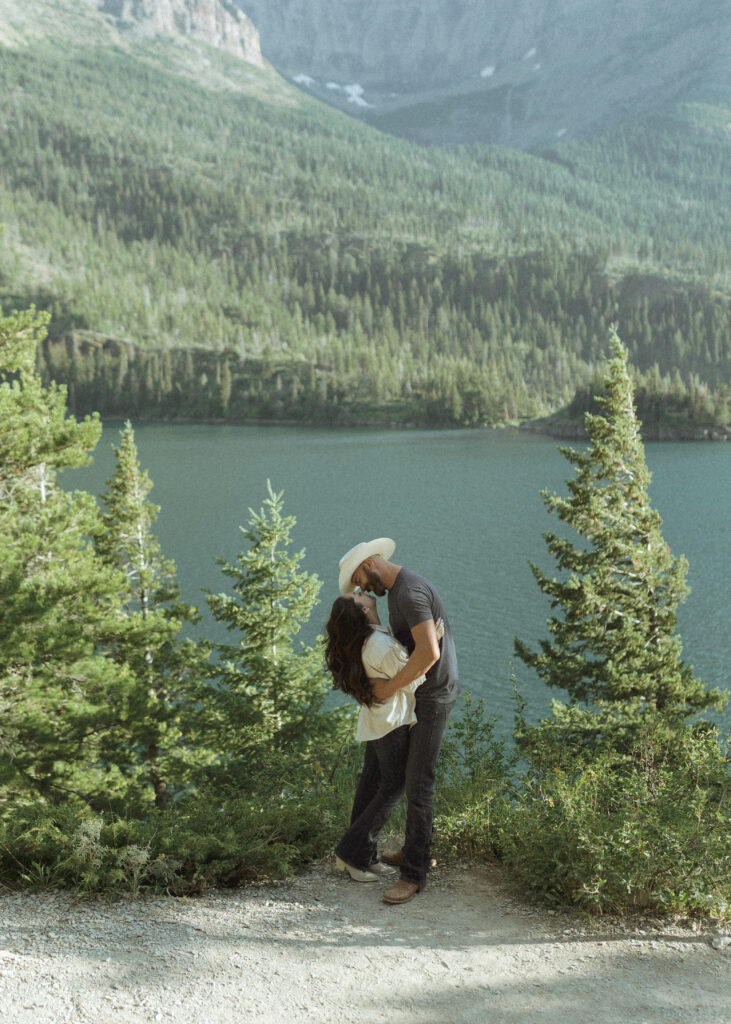 couple taking casual photos the day after their lake McDonald elopement
