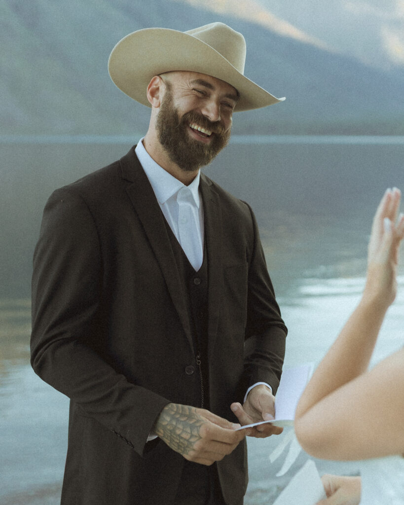 bride and groom reading their vows for their Lake McDonald Elopement