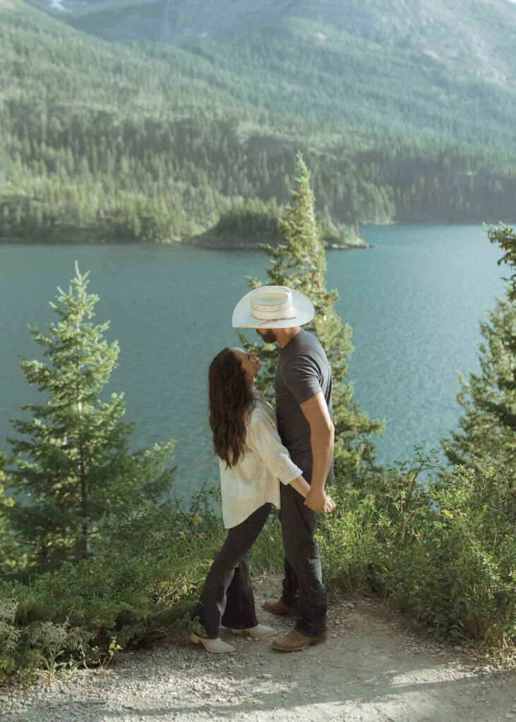 couple taking casual photos the day after their lake McDonald elopement