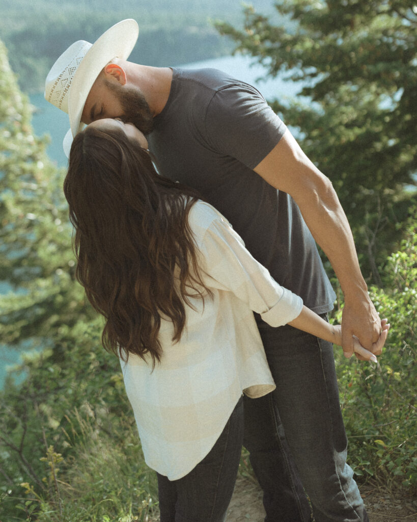 couple taking casual photos the day after their lake McDonald elopement