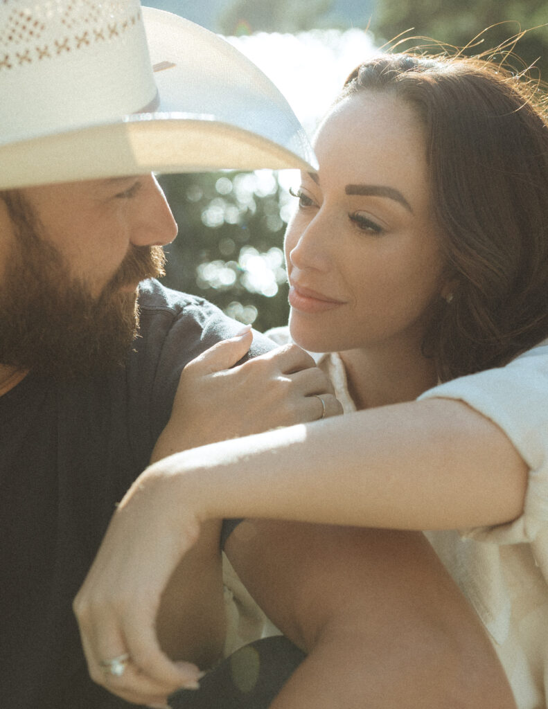couple taking casual photos the day after their lake McDonald elopement