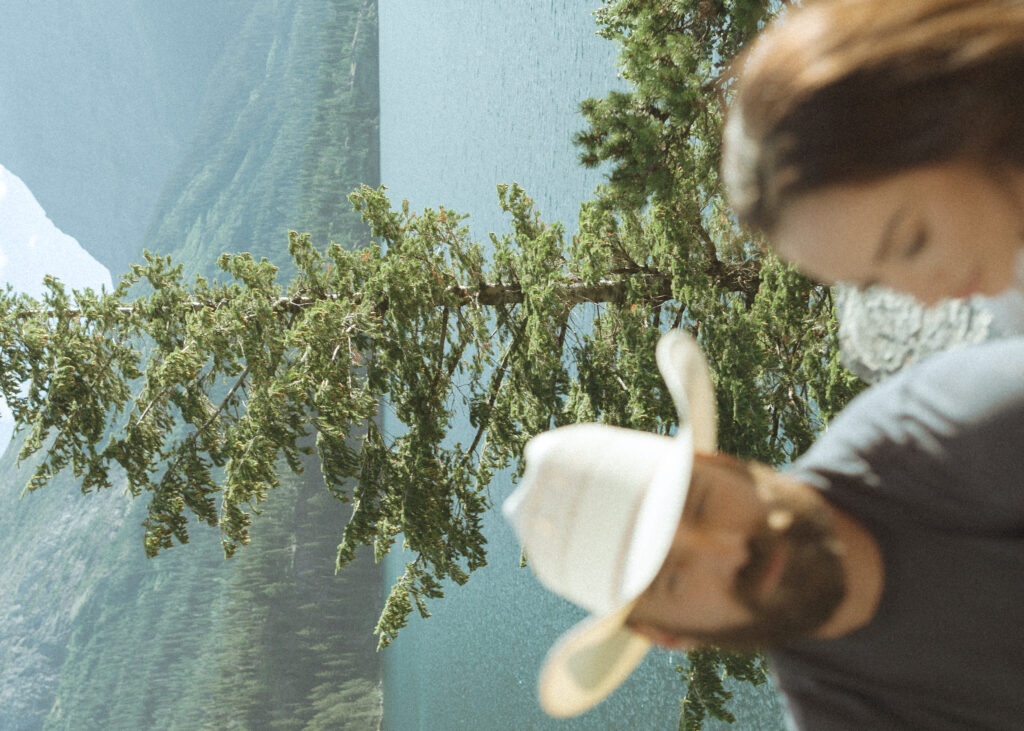 couple taking casual photos the day after their lake McDonald elopement