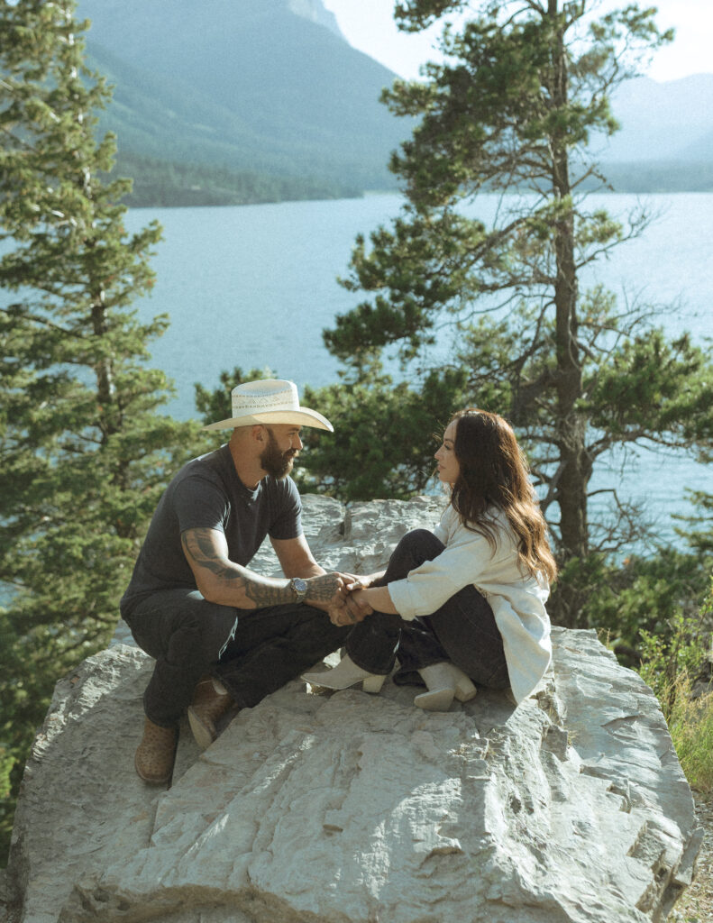 couple taking casual photos the day after their lake McDonald elopement