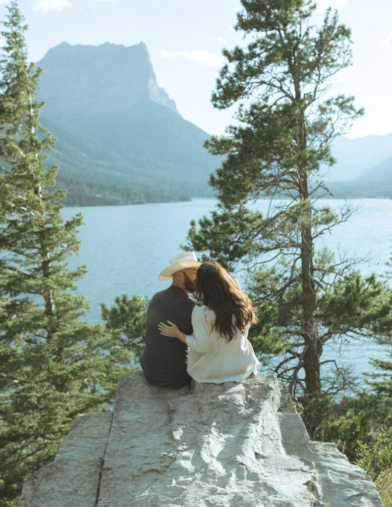couple taking casual photos the day after their lake McDonald elopement