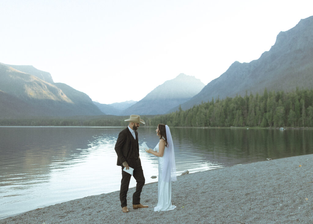 bride and groom reading their vows for their Lake McDonald Elopement