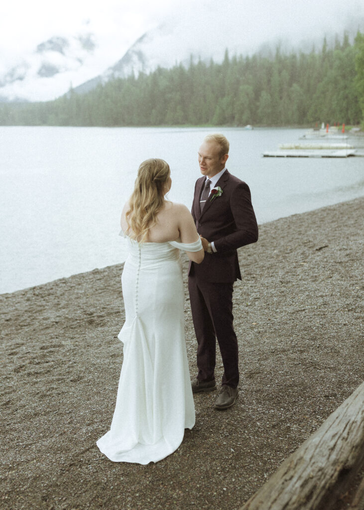 bride and grooms first look at Lake McDonald lodge