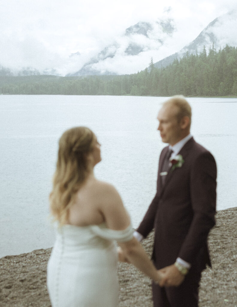 bride and grooms first look at Lake McDonald lodge