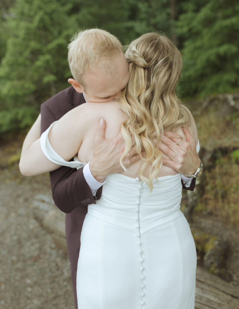 bride and grooms first look at Lake McDonald lodge