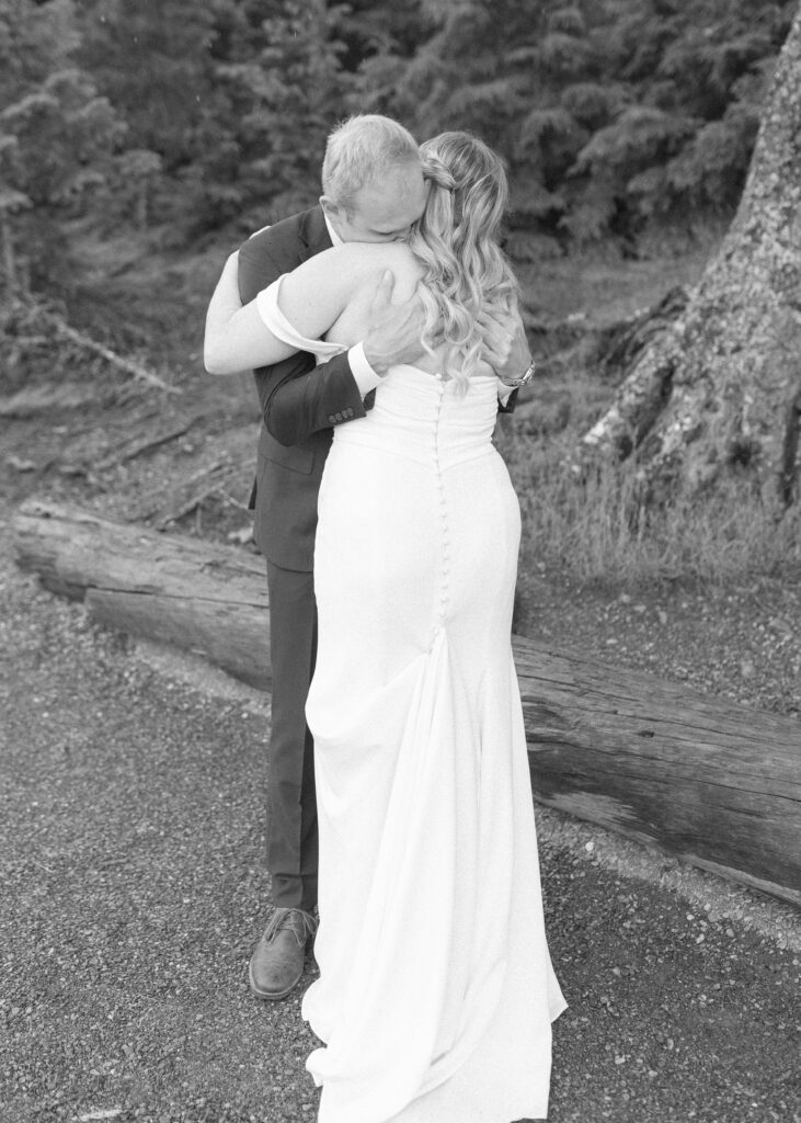 bride and grooms first look at Lake McDonald lodge