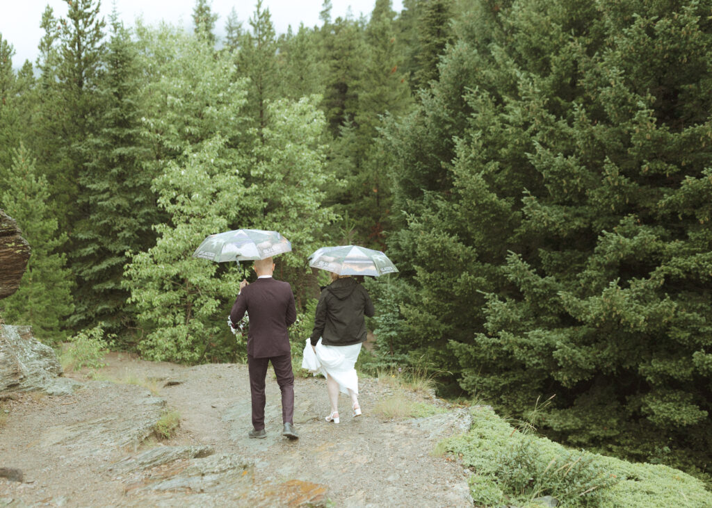 bride and groom taking photos after their lake McDonald Lodge Elopement