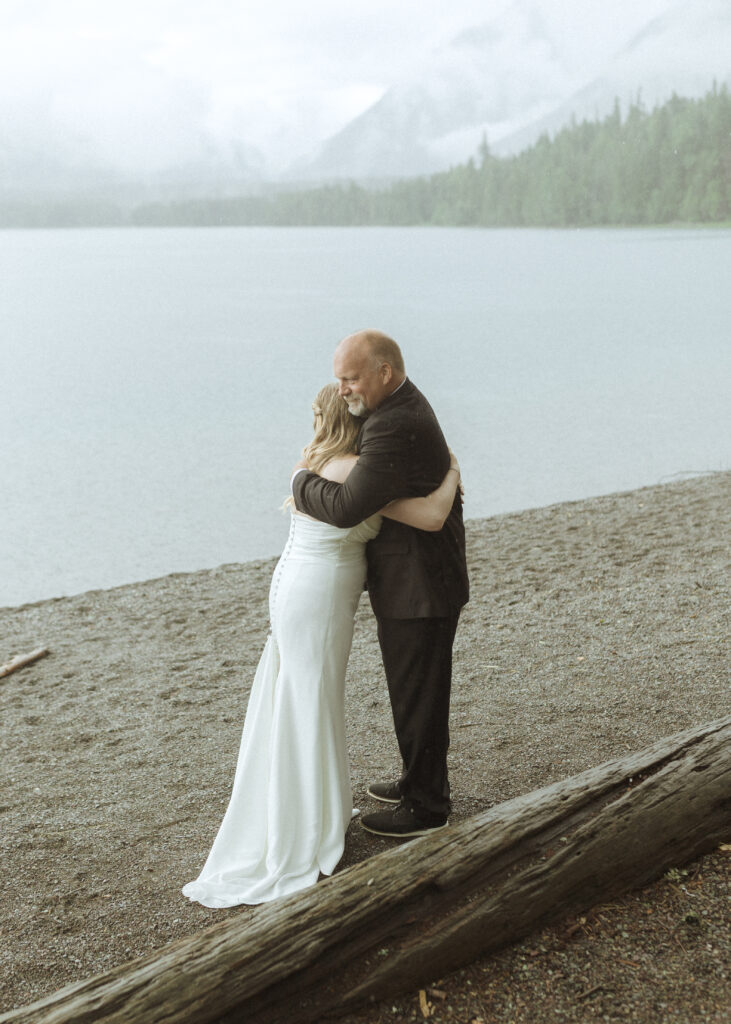 bride and dads first look at Lake McDonald lodge