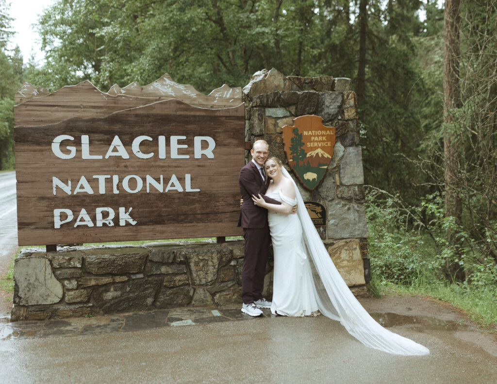 bride and groom taking photos after their lake McDonald Lodge Elopement