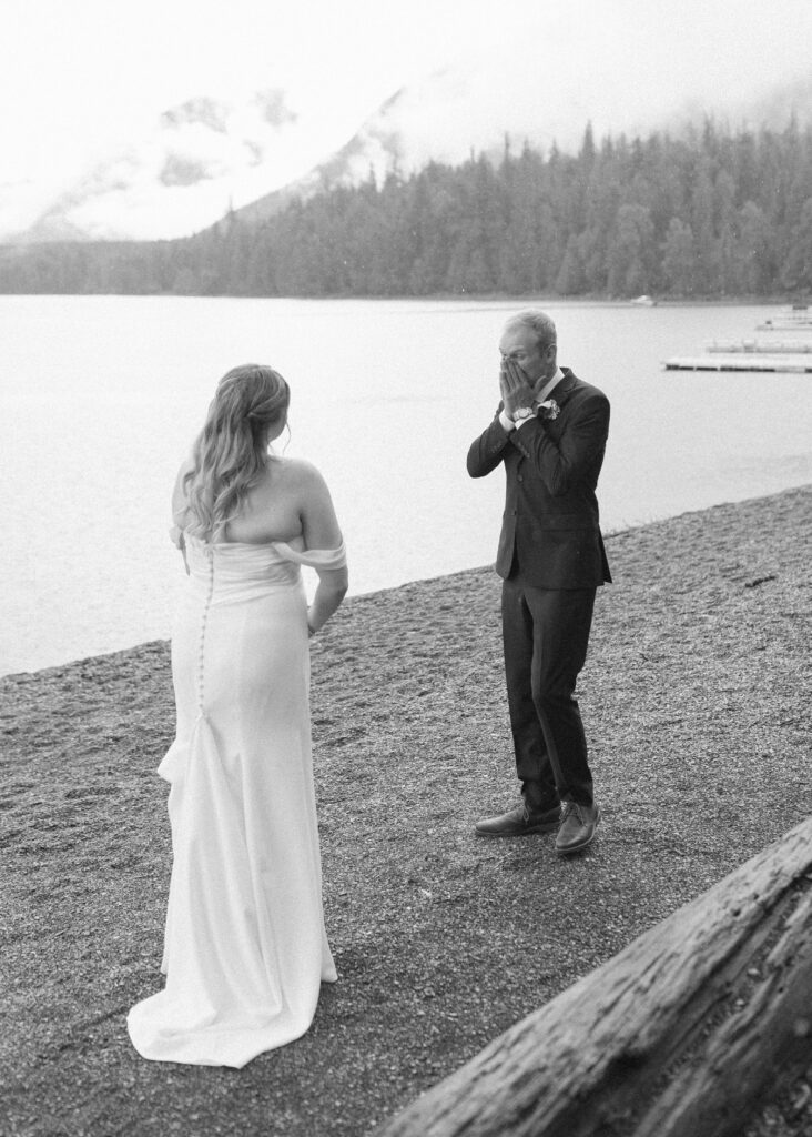 bride and grooms first look at Lake McDonald lodge