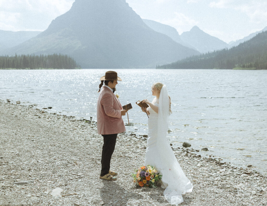 couple reading their vows for their logan pass elopement