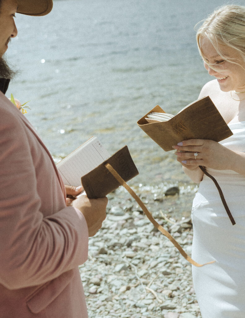 couple reading their vows for their logan pass elopement