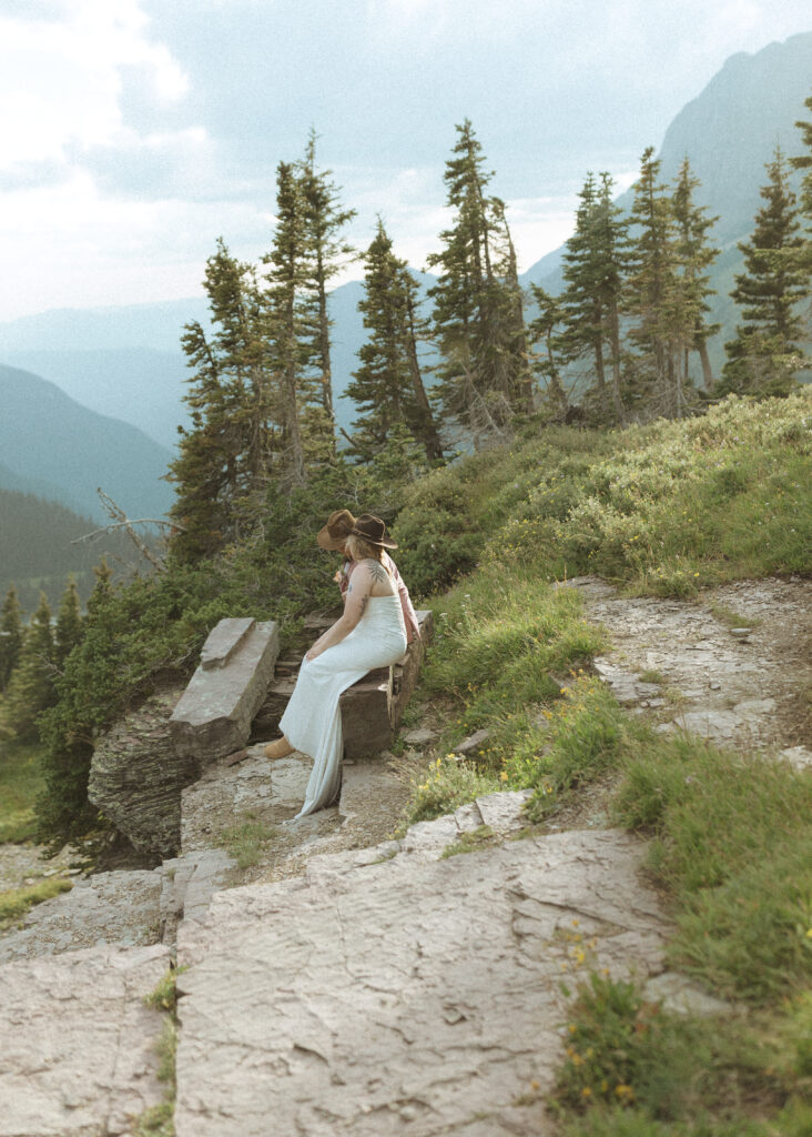 couple taking their wedding photos for their logan pass elopement