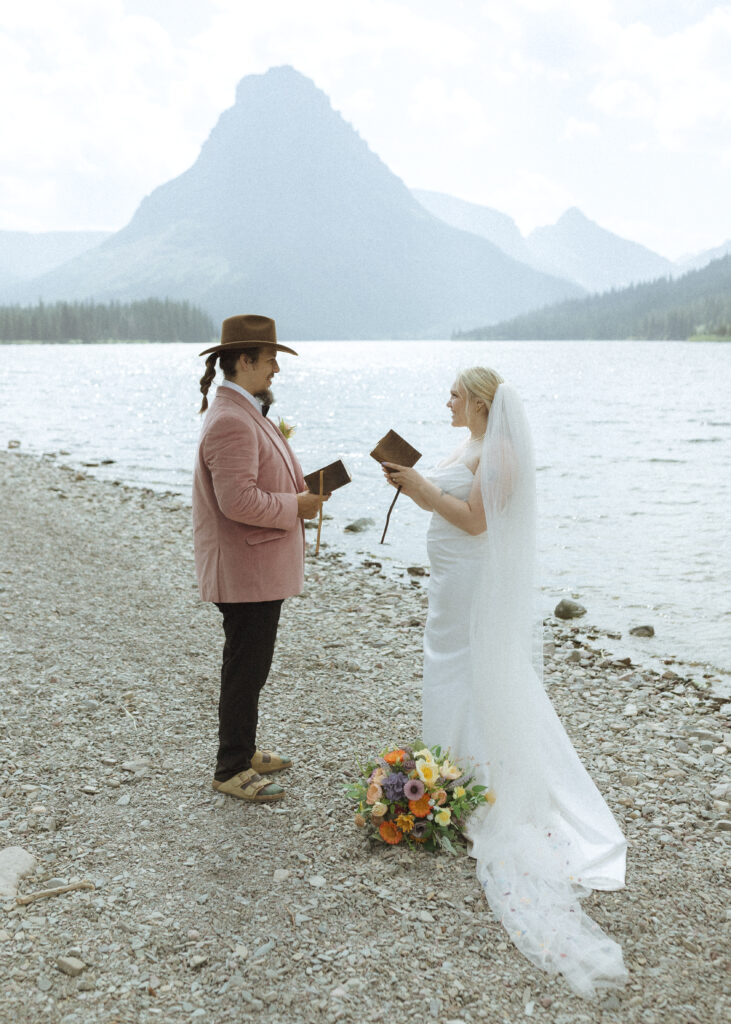 couple reading their vows for their logan pass elopement