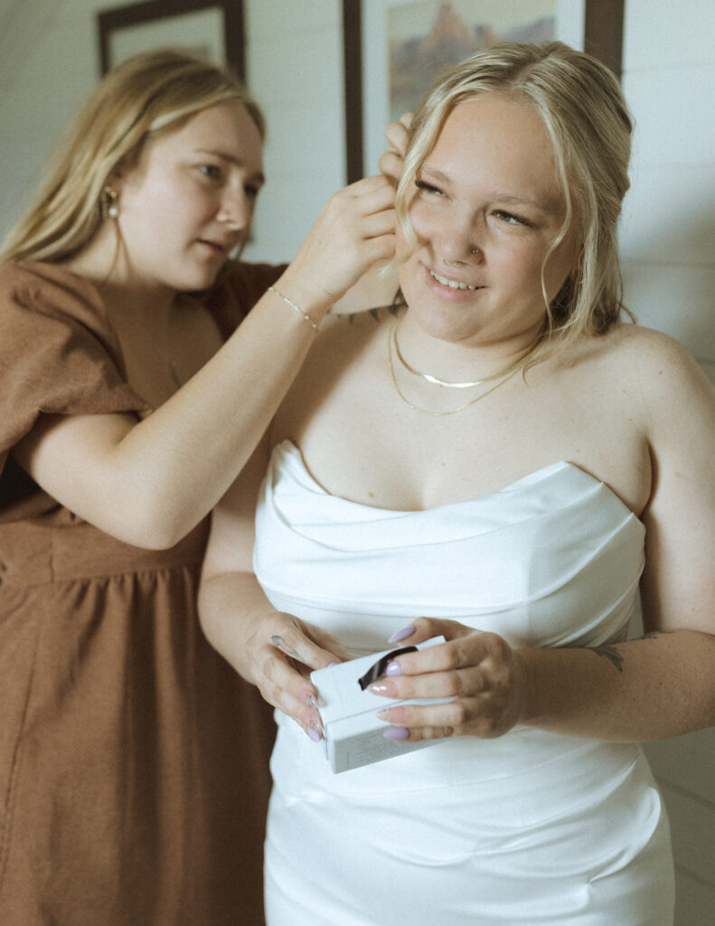 bride getting ready for her logan pass elopement
