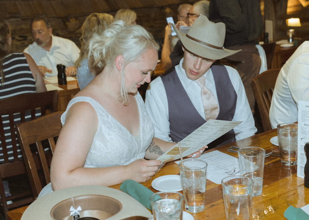 bride and groom at dinner after their wedding at mountain view turnout