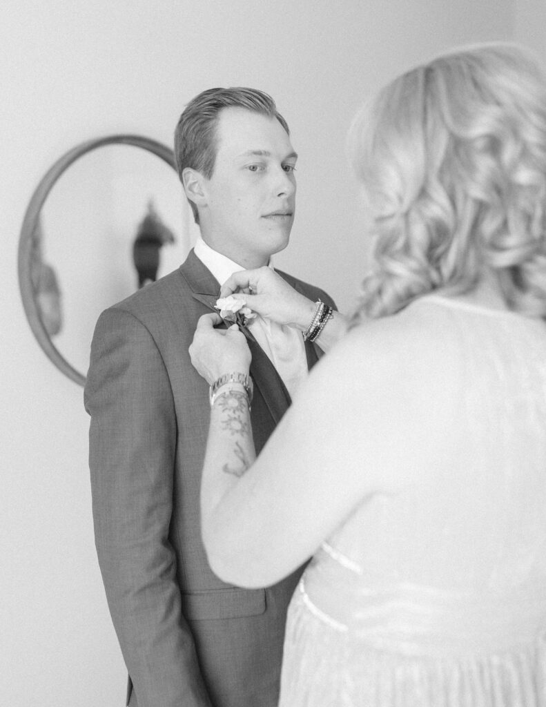 groom getting ready for his mountain view turnout wedding