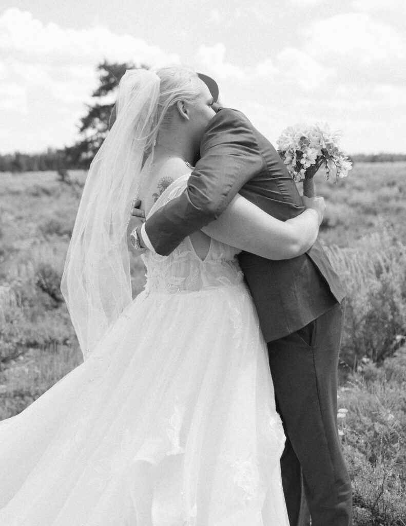 bride and groom reading their vows privately before their mountain view turnout wedding