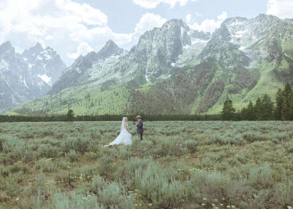 bride and groom reading their vows privately before their mountain view turnout wedding