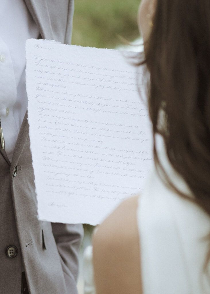 couple reading their vows at their Schwabacher Landing Elopement