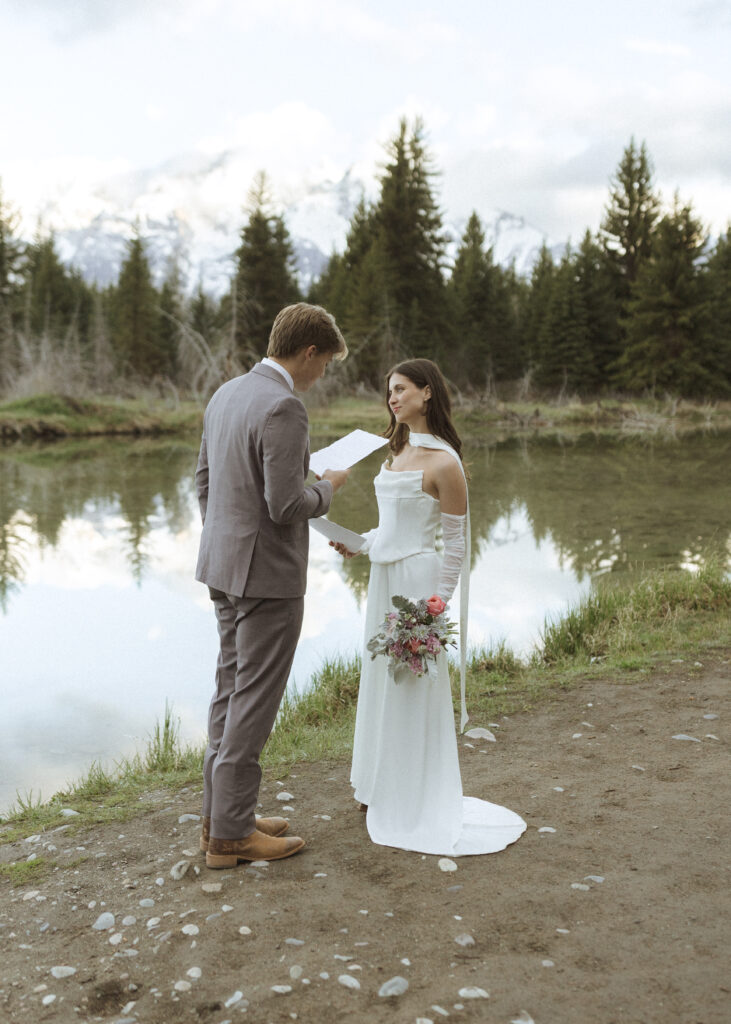 couple reading their vows at their Schwabacher Landing Elopement