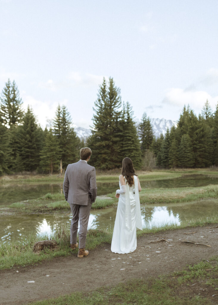 couple taking their wedding photos at their Schwabacher Landing Elopement