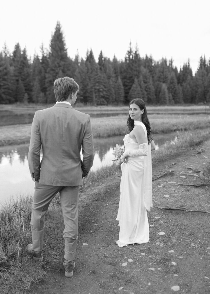 couple taking their wedding photos at their Schwabacher Landing Elopement