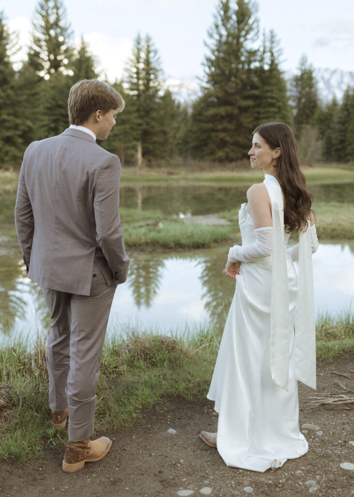couple taking their wedding photos at their Schwabacher Landing Elopement