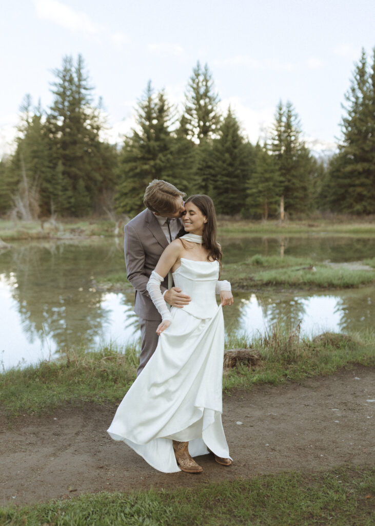 couple taking their wedding photos at their Schwabacher Landing Elopement
