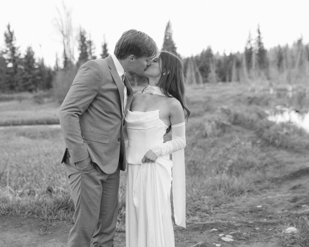 couple taking their wedding photos at their Schwabacher Landing Elopement