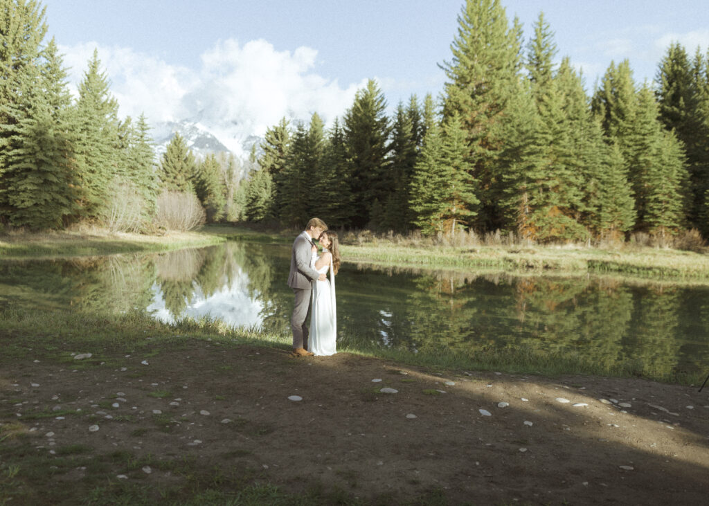 couple taking their wedding photos at their Schwabacher Landing Elopement