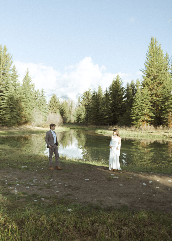 couple taking their wedding photos at their Schwabacher Landing Elopement