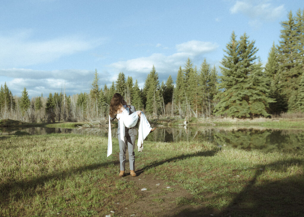 couple taking their wedding photos at their Schwabacher Landing Elopement