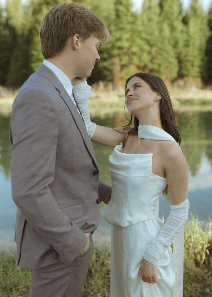 couple taking their wedding photos at their Schwabacher Landing Elopement