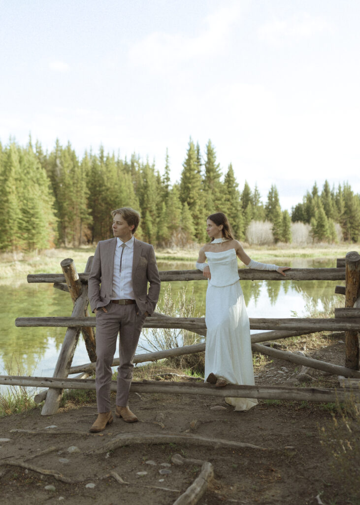 couple taking their wedding photos at their Schwabacher Landing Elopement