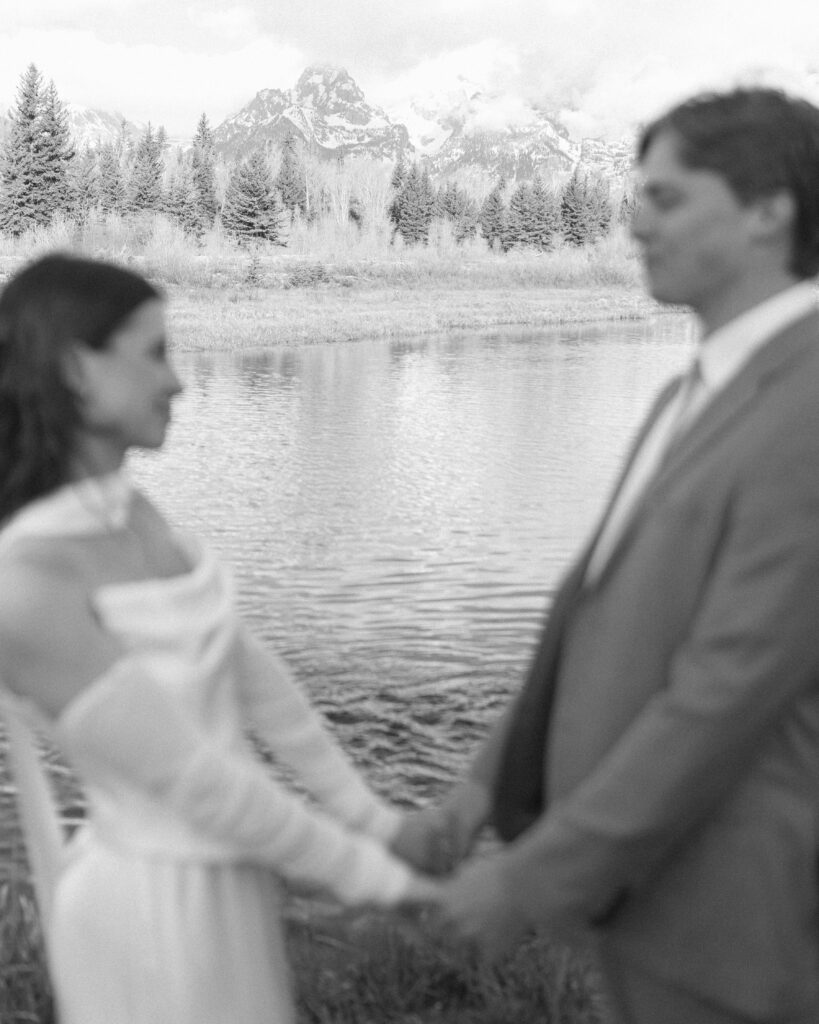 couple taking their wedding photos at their Schwabacher Landing Elopement