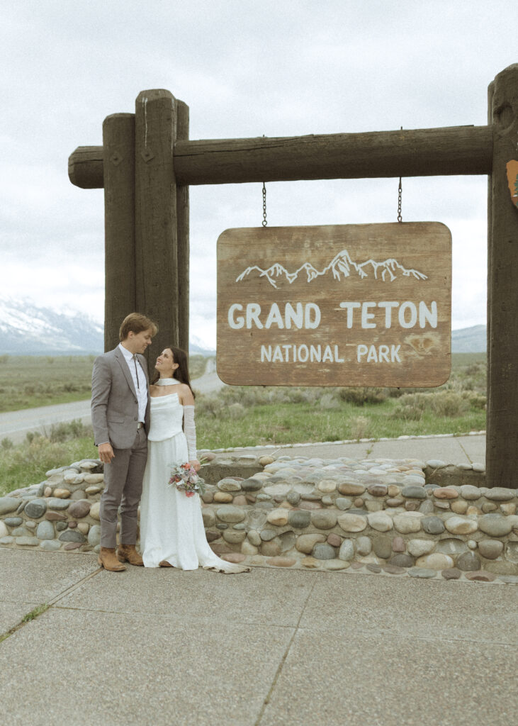 couple taking their wedding photos at their Schwabacher Landing Elopement