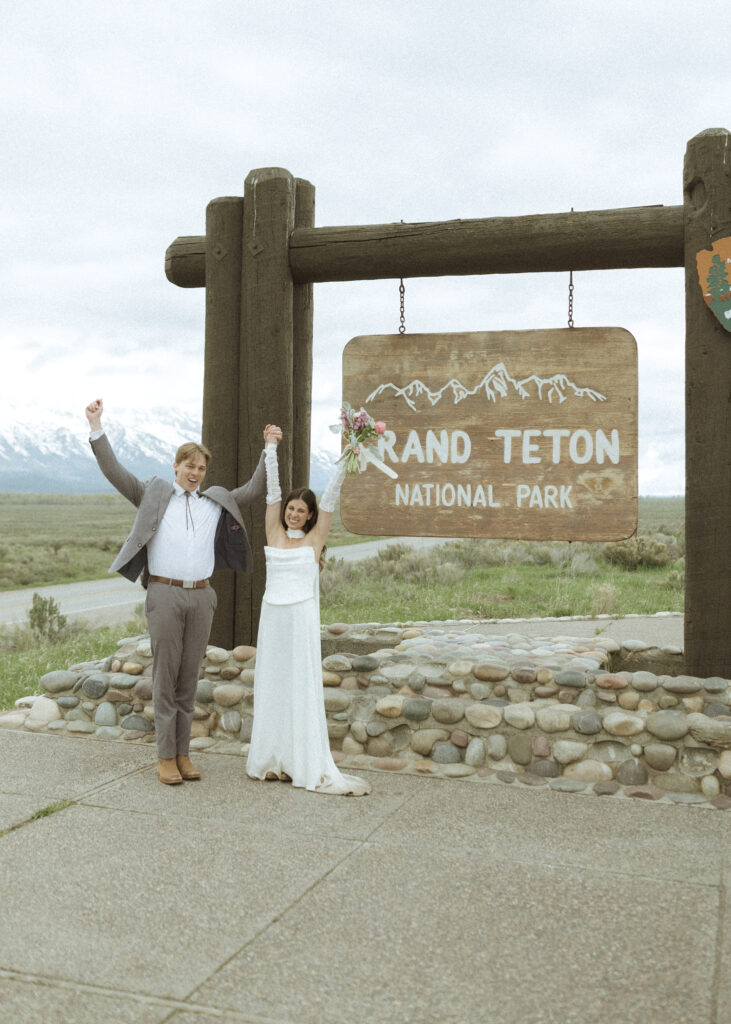 couple taking their wedding photos at their Schwabacher Landing Elopement