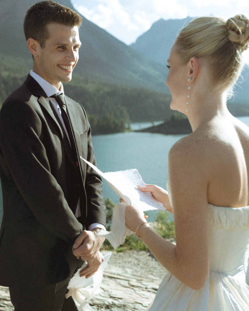 bride and groom reading vows at their sun point elopement
