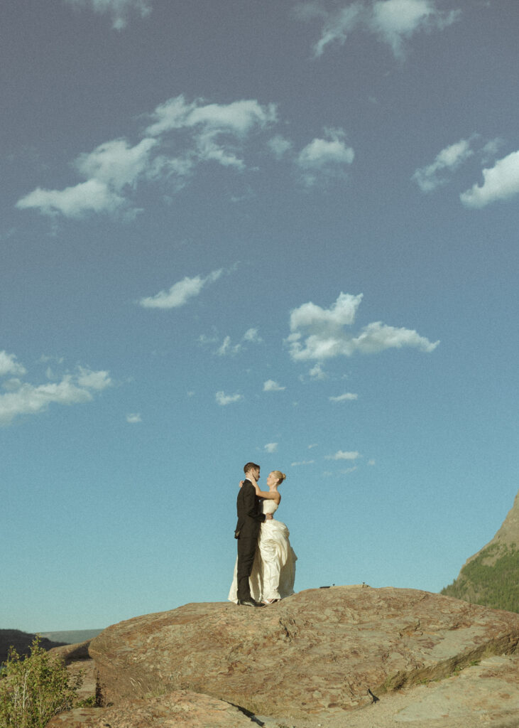 bride and groom taking photos for their sun point elopement