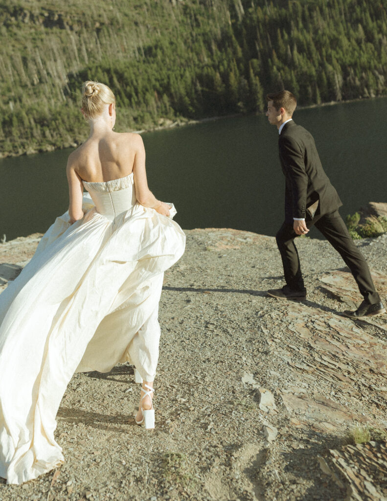 bride and groom taking photos for their sun point elopement