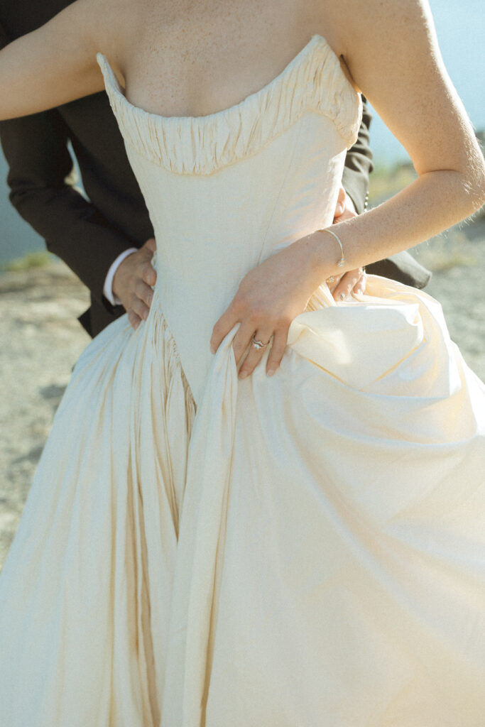 bride and groom taking photos for their sun point elopement
