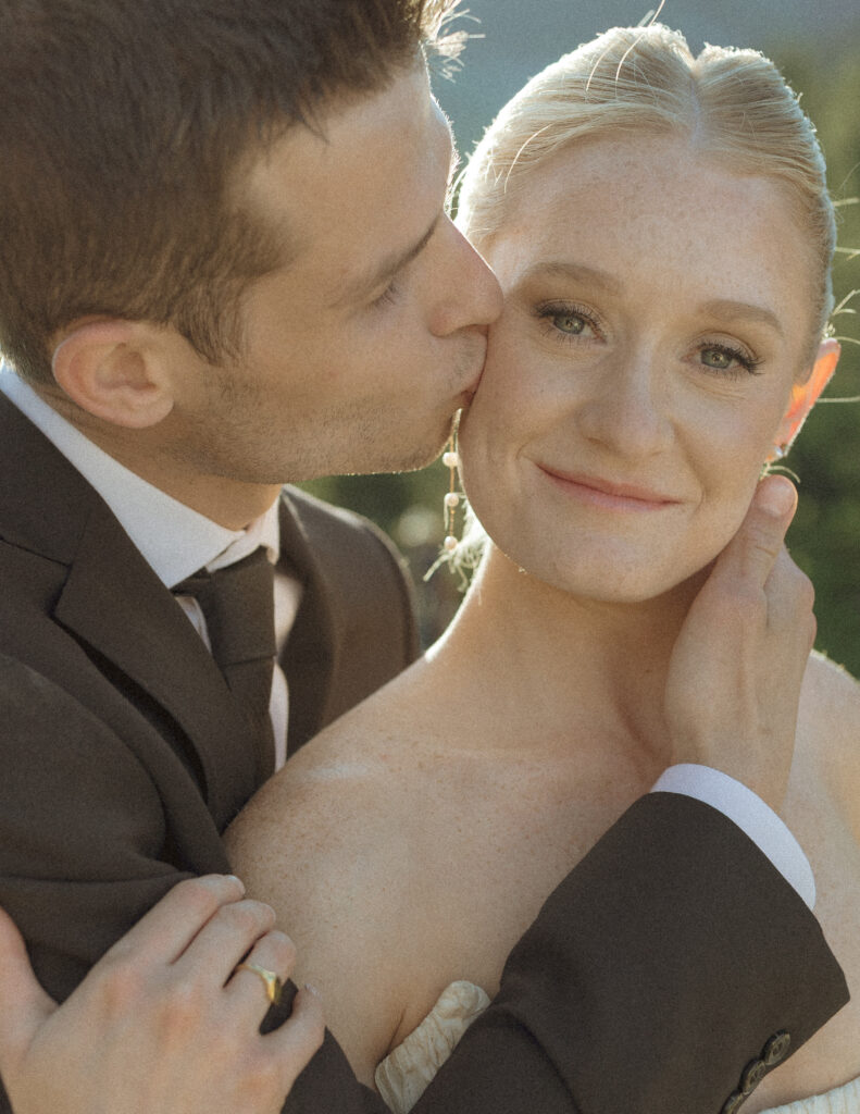 bride and groom taking photos for their sun point elopement